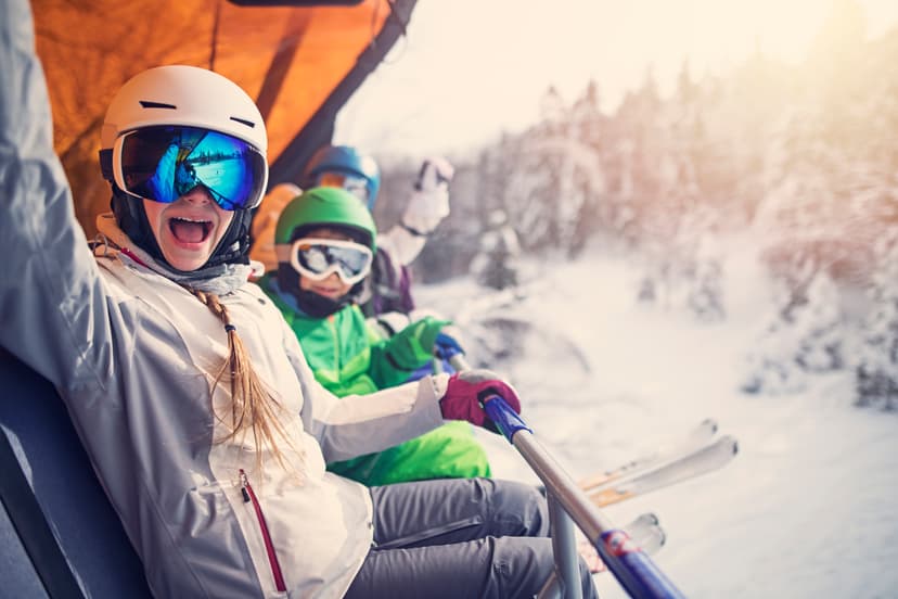 https://a.storyblok.com/f/150663/3864x2576/c66025c9d2/mother-with-kids-sitting-on-a-ski-lift.jpg