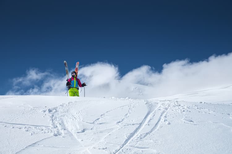 off piste skier looking at snowy slope