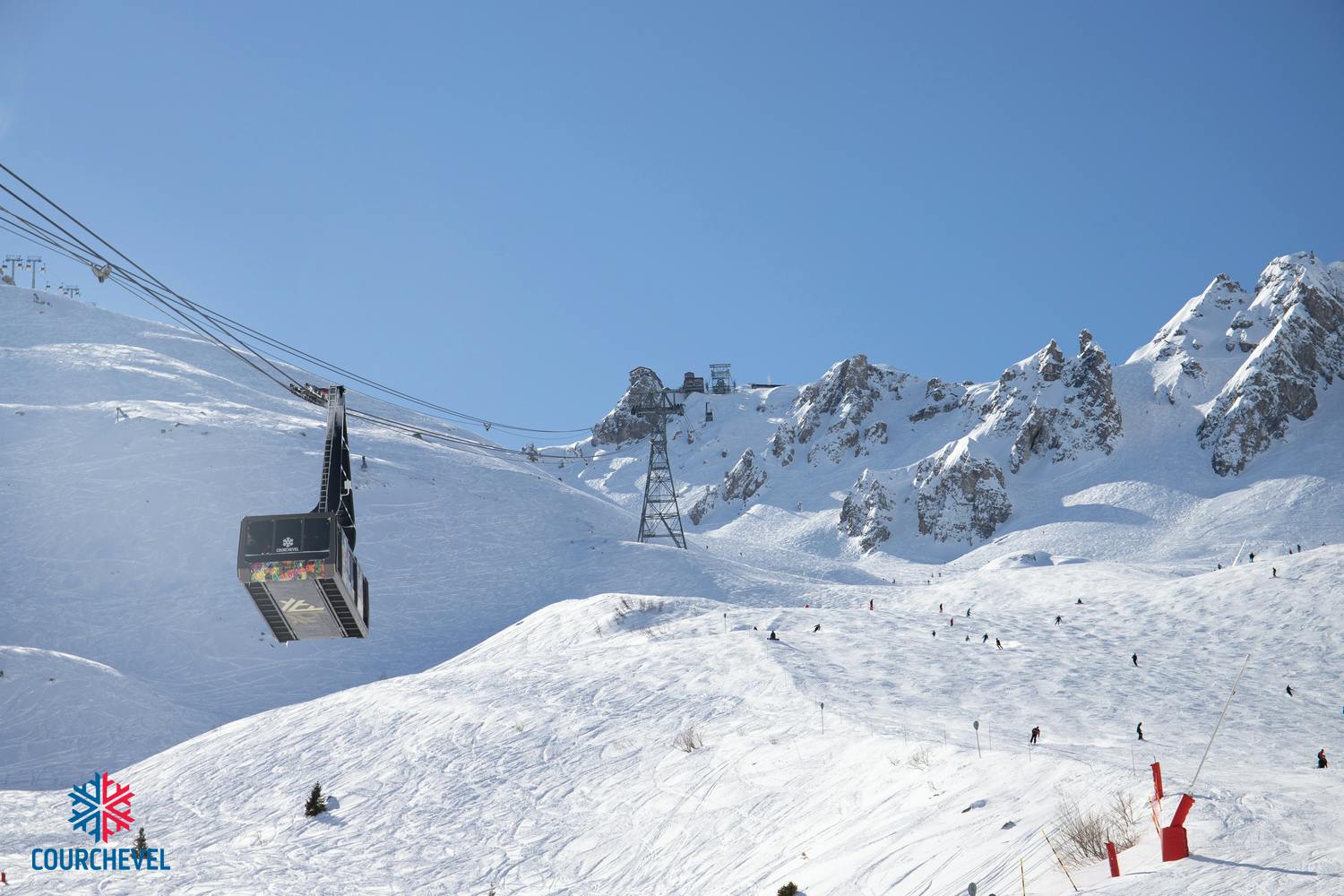 Gondola taking skiiers to top of french alps mountain