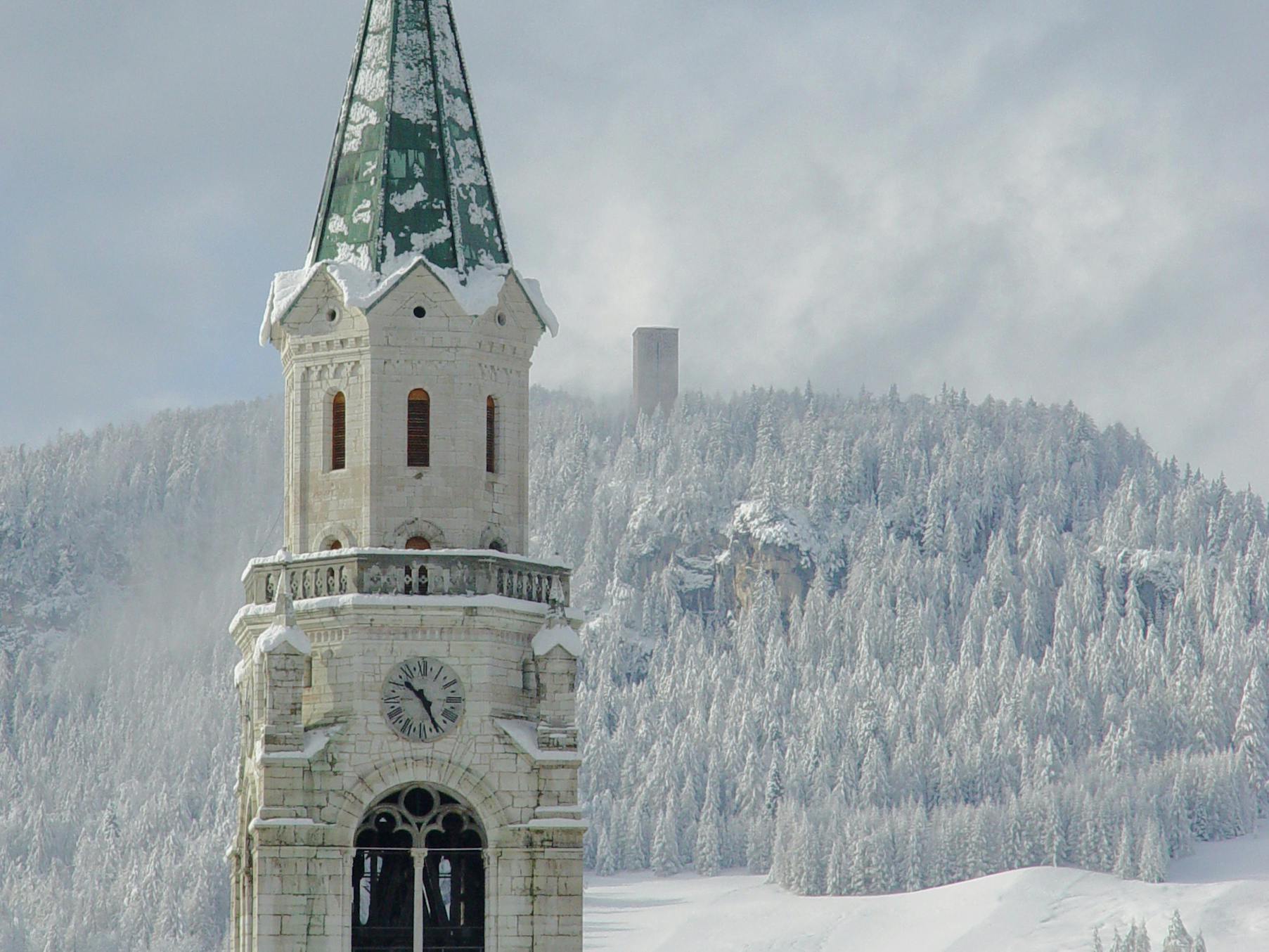 Traditional church tower at Italian ski resort Cortina D'ampezzo