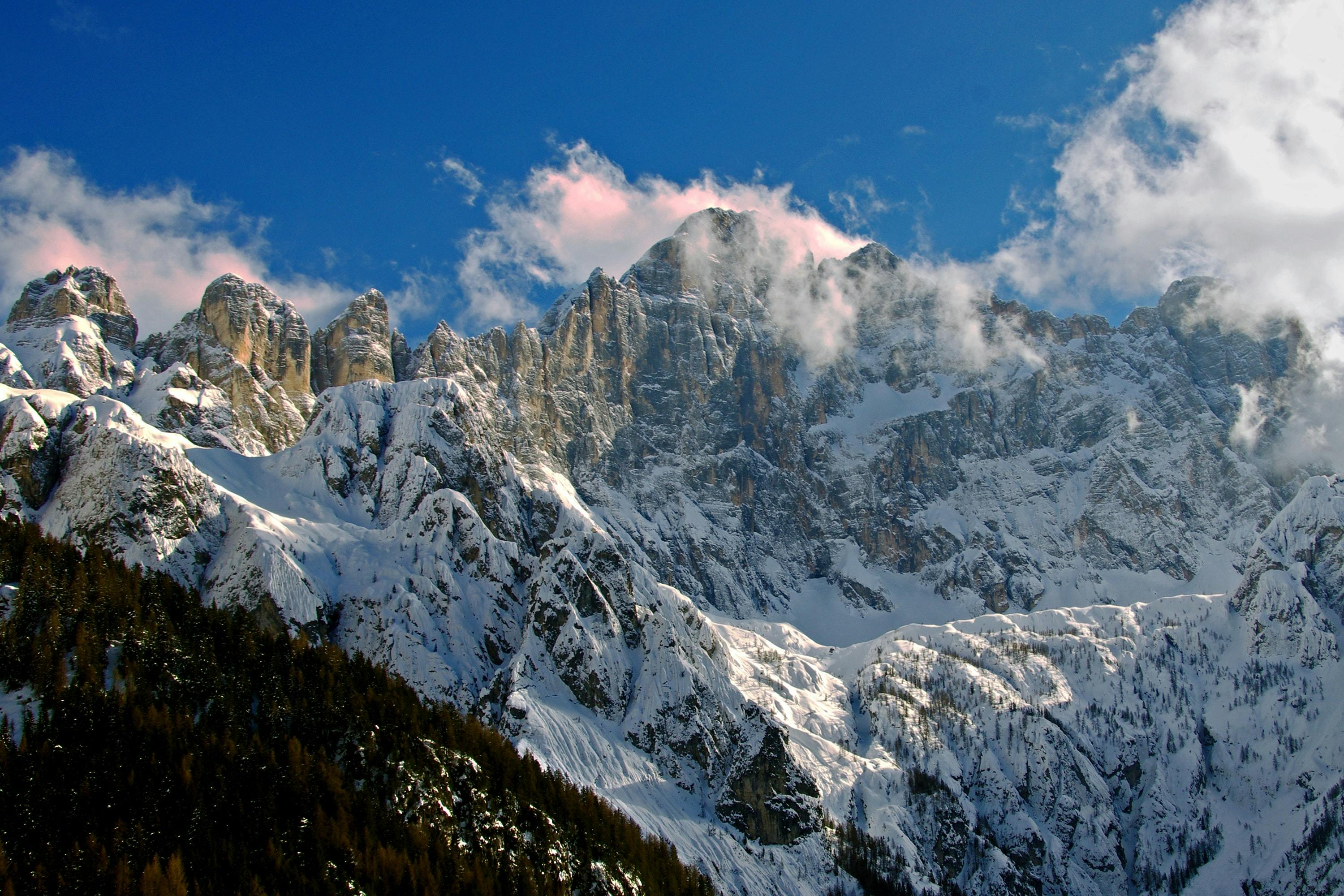 Dolomites snowy mountain range