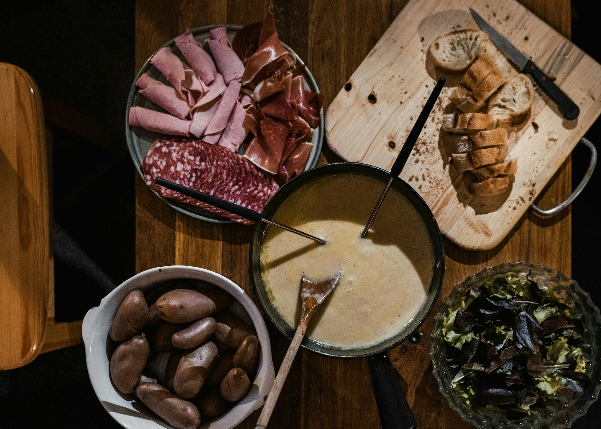 Cheesy fondue and cured meats at French Alps restaurant