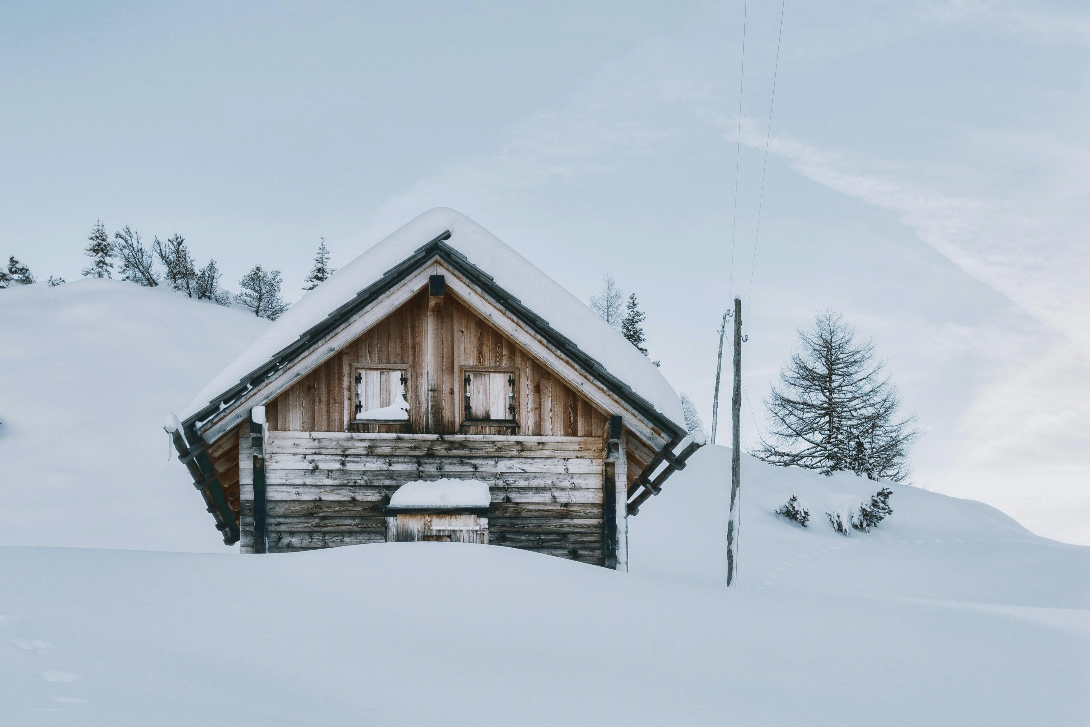 Isolated snowy mountain hut