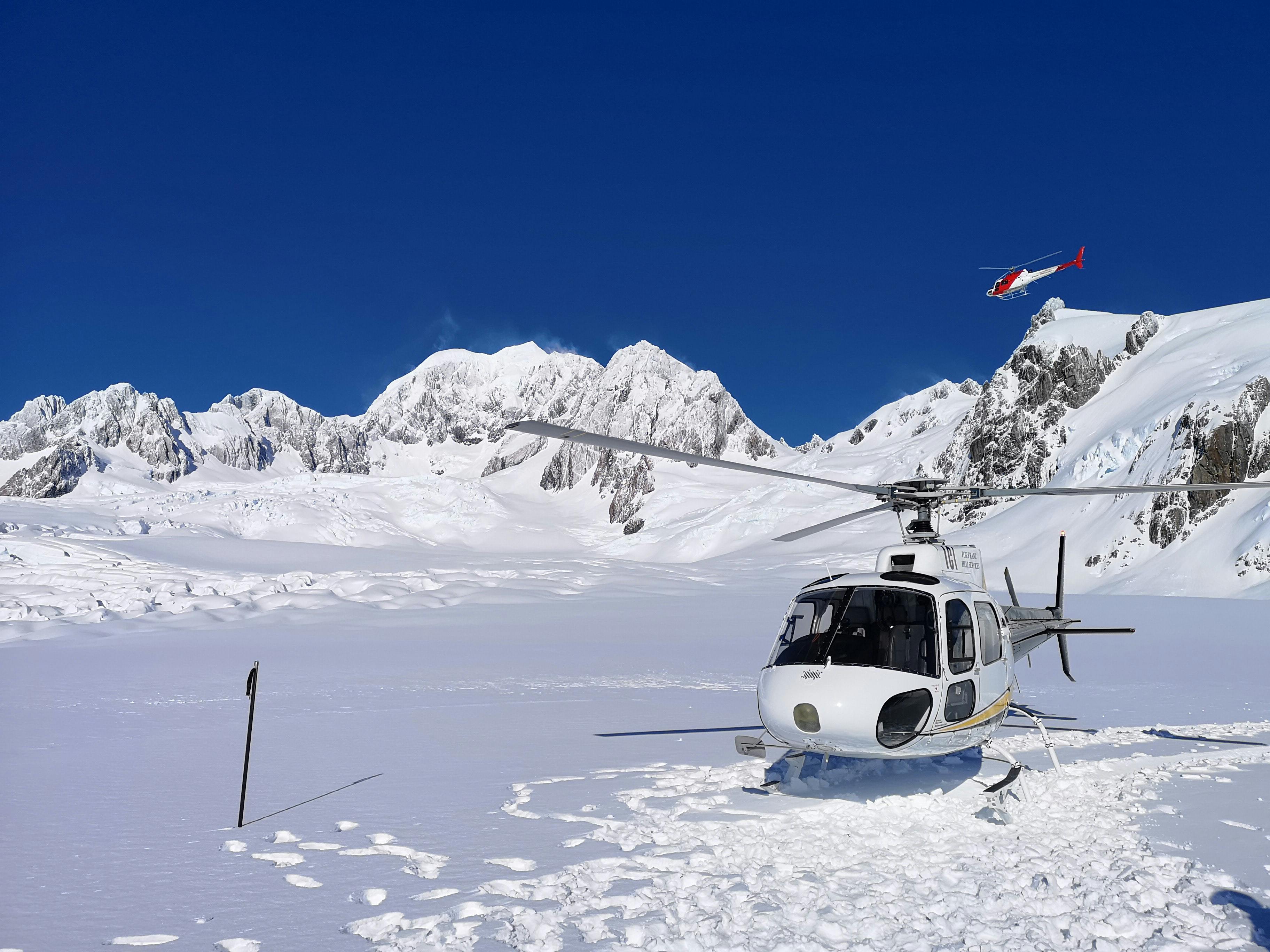 Helicopter waiting to take holiday goers on ride above French Mountains