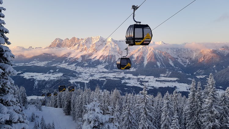 Gondolas taking skiers to top of ski mountain in Schladming Austria