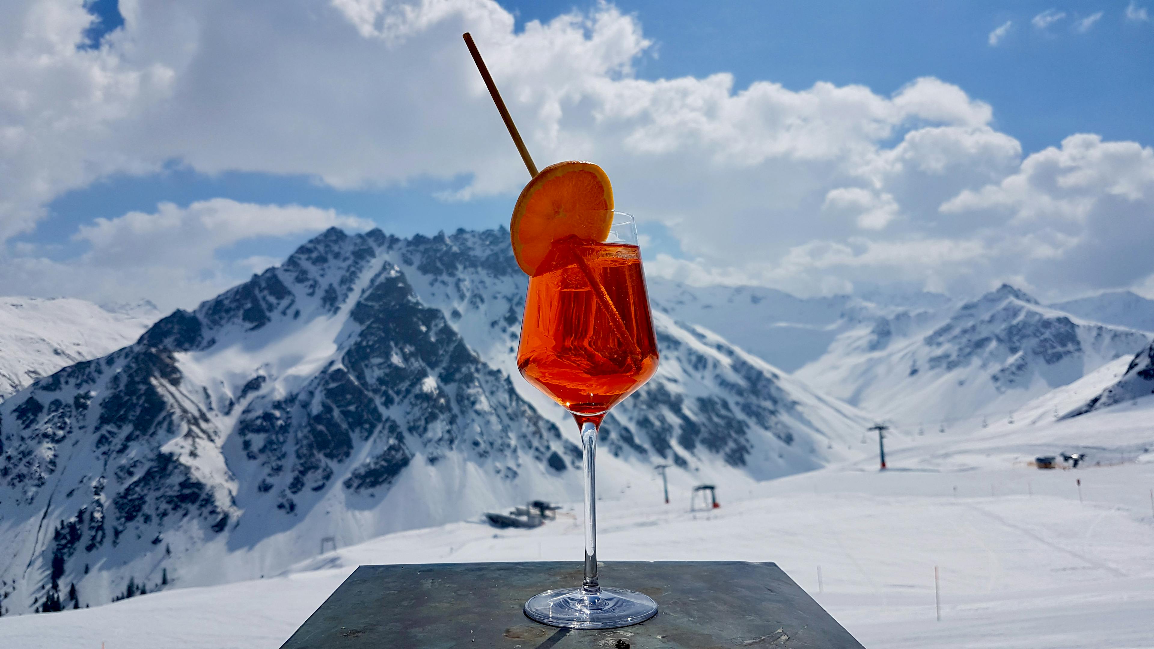 Aperol Spritz with the mountains in the background