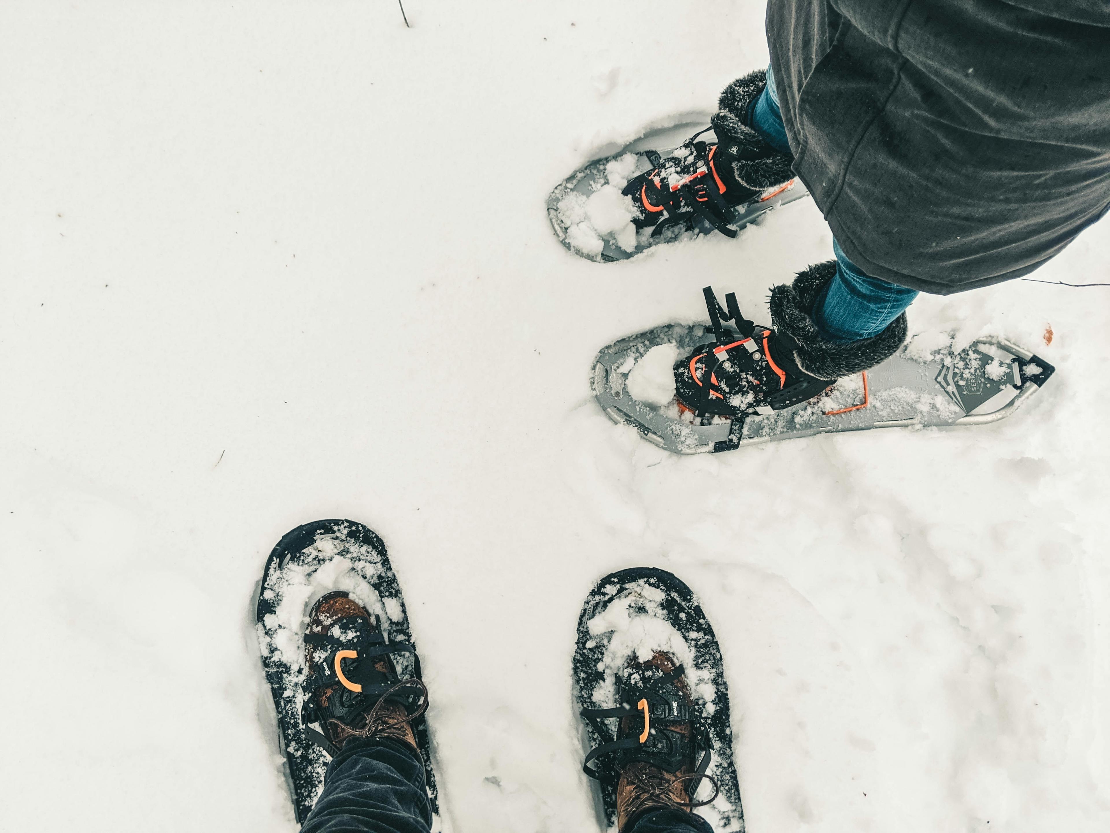 Couple going snow shoeing in French Alps