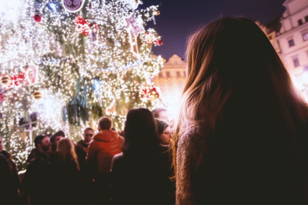 Families admiring Christmas market lights