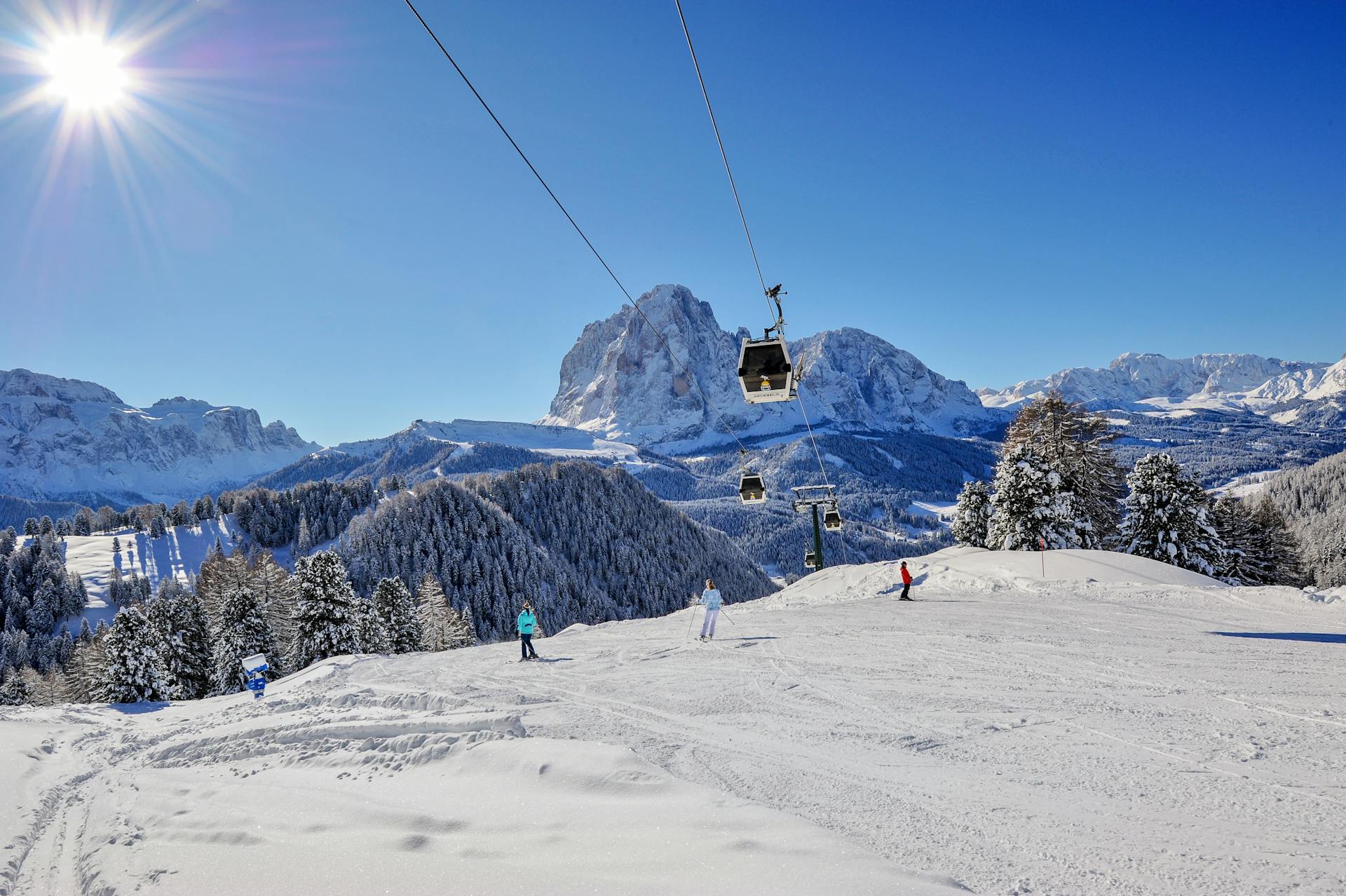 Skiiers on ski slope under Gondola
