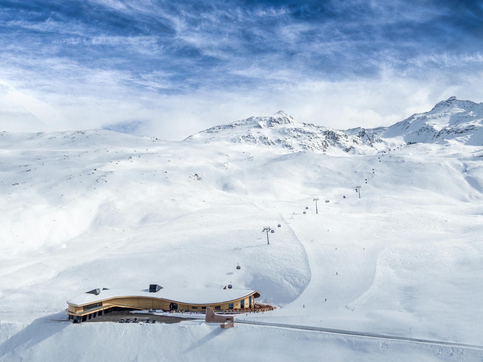 Obergurgl ski resort chairlifts above slopes on sunny day