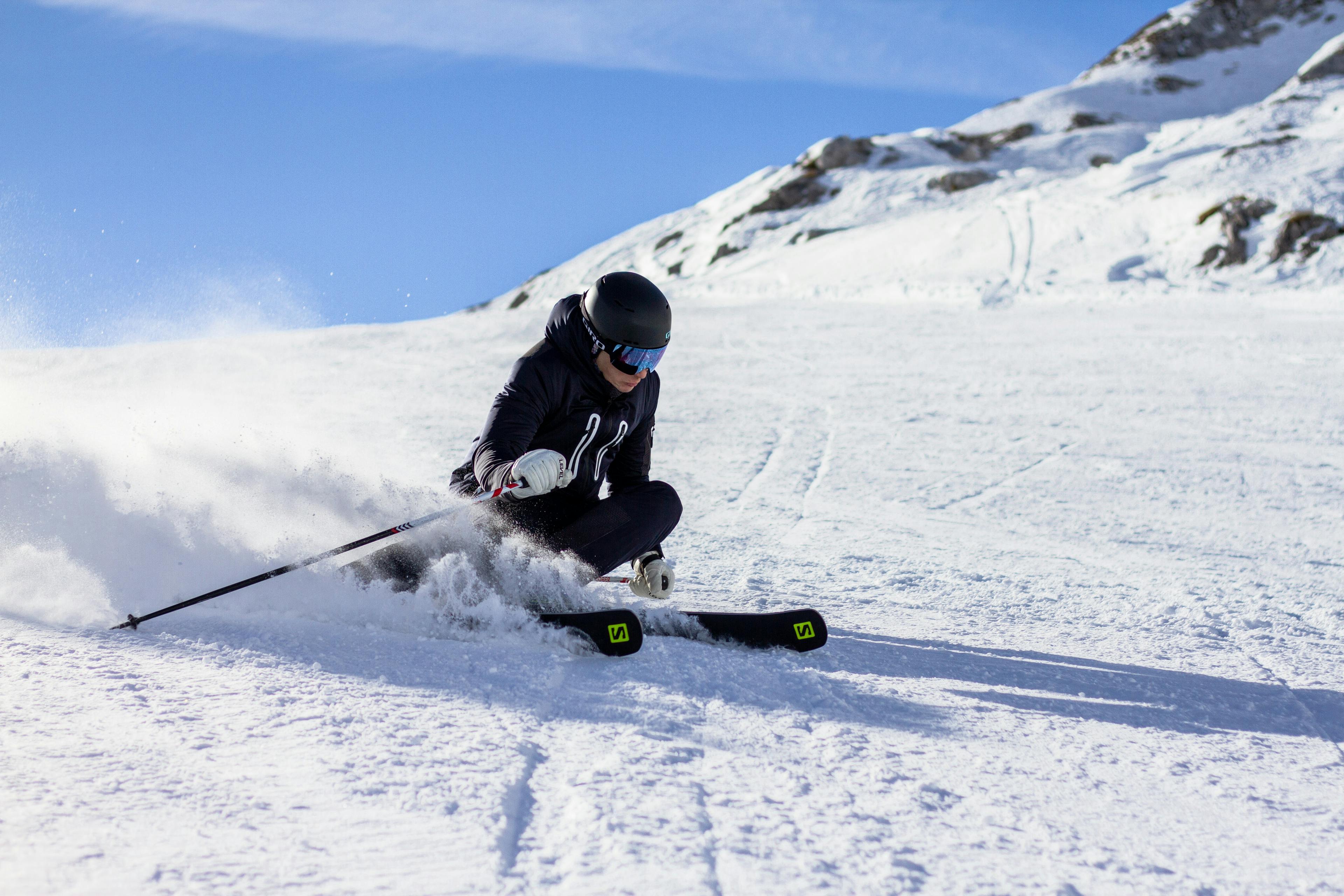 Skier carving turn on slope