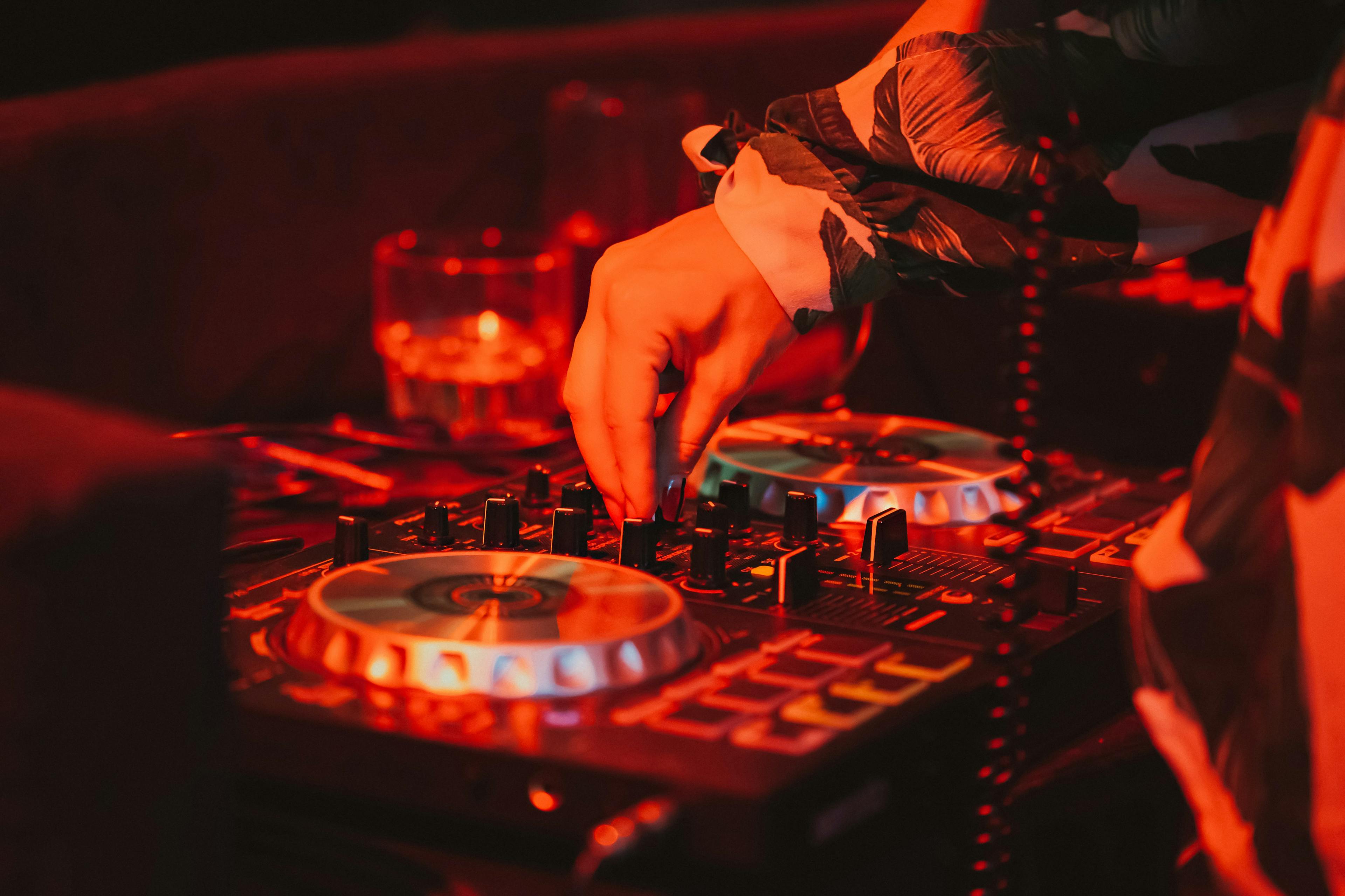 DJ mixing music on turntables at Apres ski nightclub