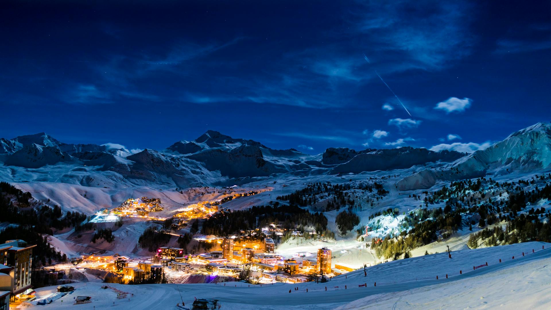 La Plagne ski resort at night with town lit up