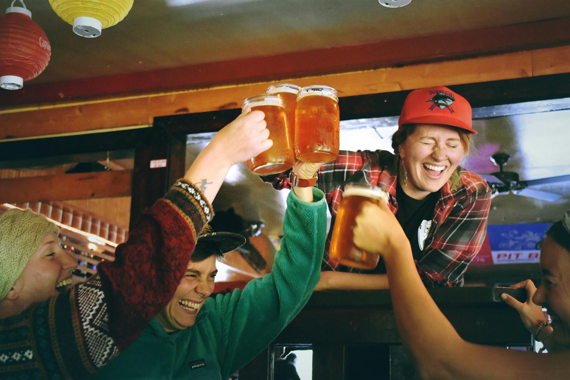 Skiers enjoying apres ski party with beers
