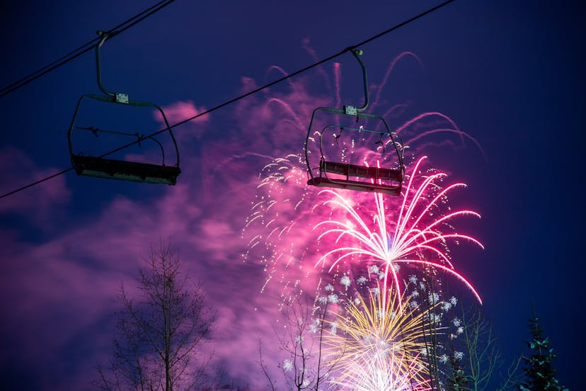 pink fireworks light ski lifts