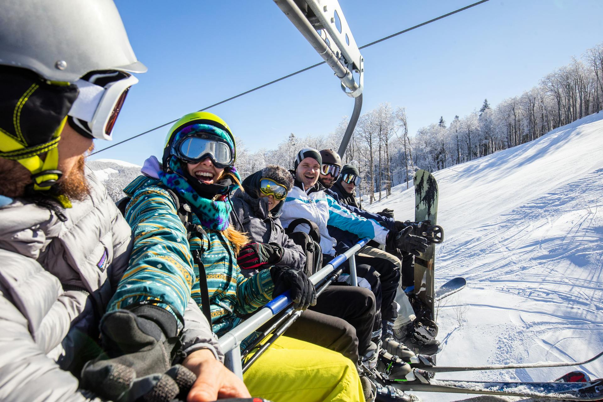 skiers smiling on chairlift at ski resort