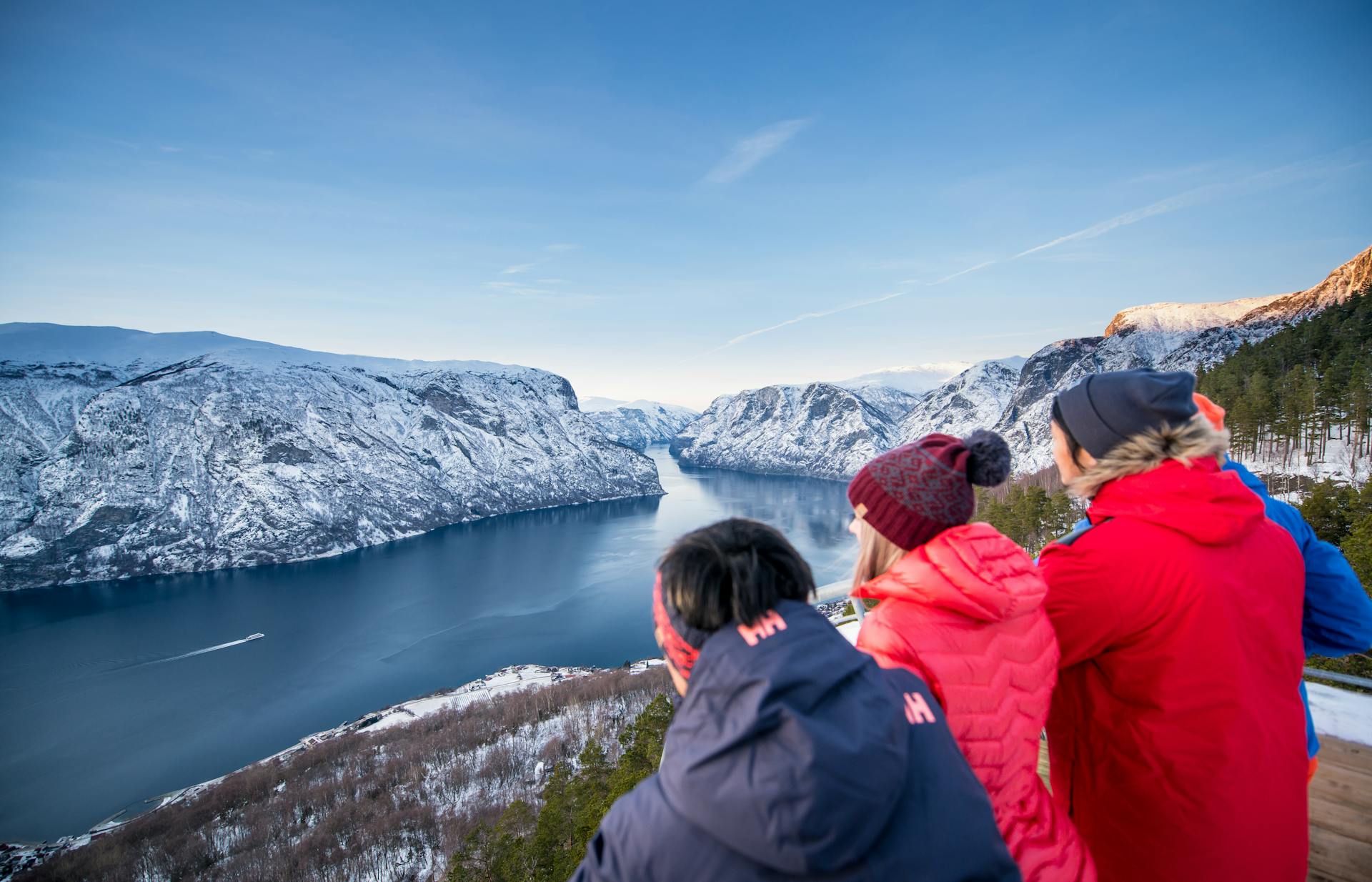 Group of friends looking at beutiful fjord scenery in myrkdalen ski resort in Norway